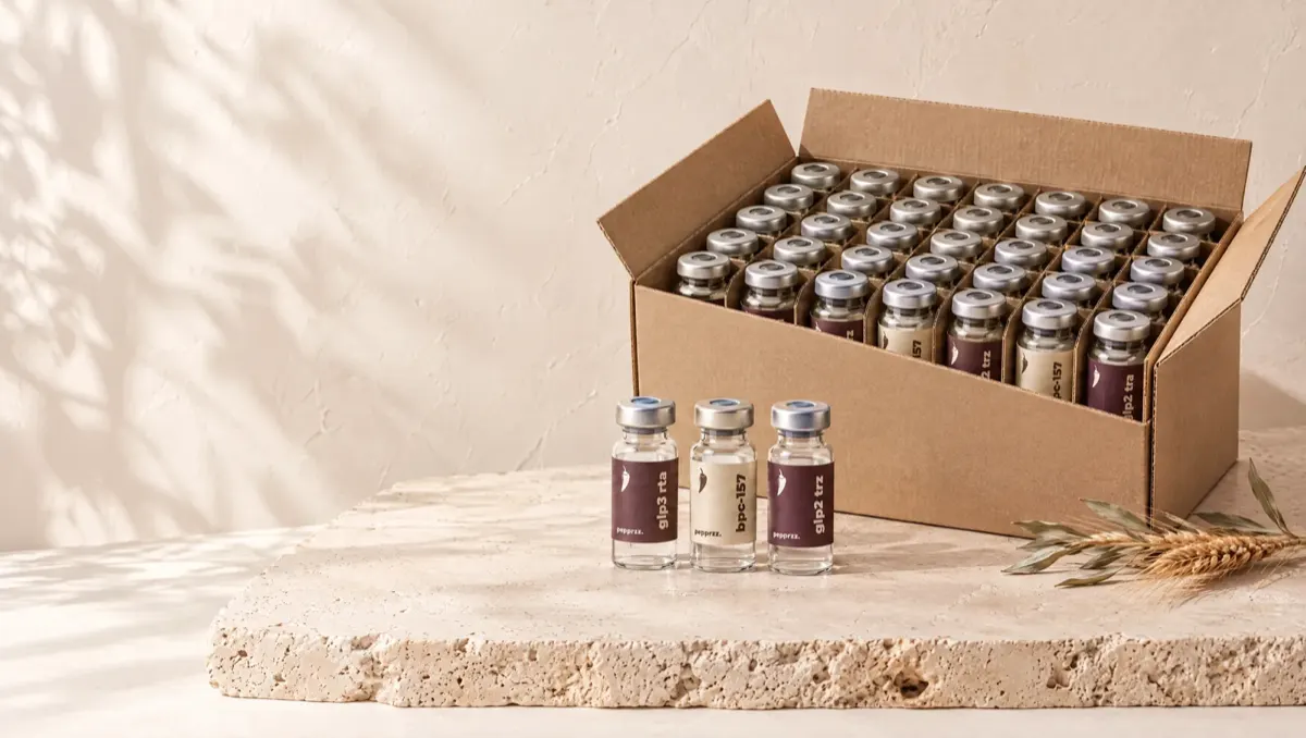 A Pepprzz case pack of vials beside three single vials
